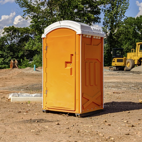 what is the cost difference between standard and deluxe portable restroom rentals in Dunlap KS